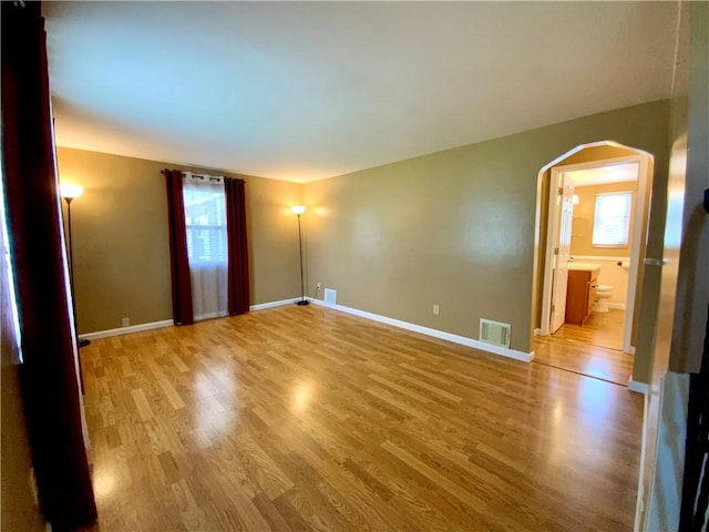 90 Steubenville Pike, Hanover Twp, PA 15021 - spare room featuring light wood-style flooring, plenty of natural light, and arched walkways