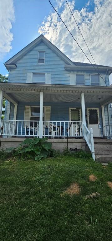 705 Carlisle St, New Castle, PA 16101 - back of house with a porch and a lawn