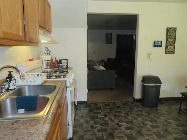 5203 Wilson Ct, Clairton, PA 15025 - kitchen featuring under cabinet range hood, white gas stove, brown cabinetry, and light countertops