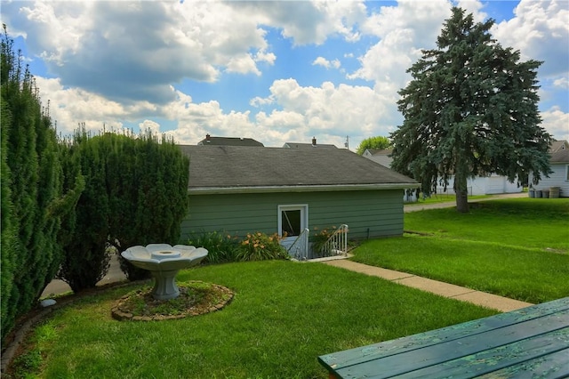 1020 Adams St, New Castle, PA 16101 - rear view of property with a lawn and a shingled roof