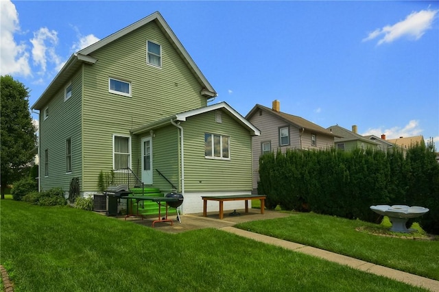 1020 Adams St, New Castle, PA 16101 - back of property featuring a lawn and a patio
