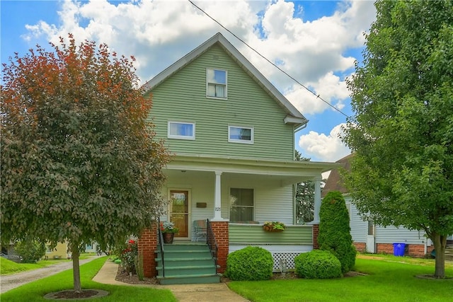 1020 Adams St, New Castle, PA 16101 - view of front of property featuring covered porch and a front yard
