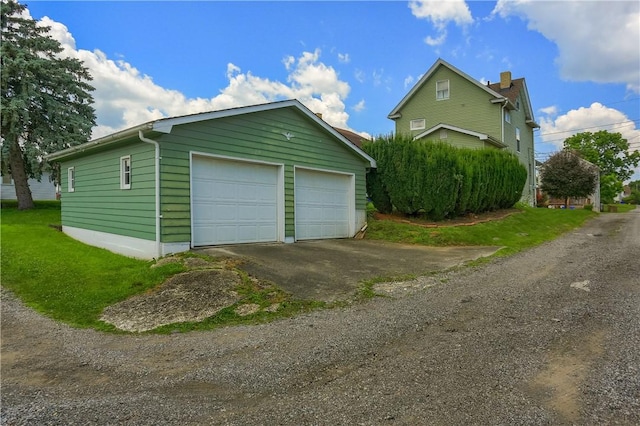 1020 Adams St, New Castle, PA 16101 - view of side of property with a detached garage, an outdoor structure, and a chimney