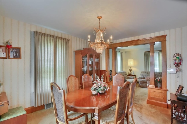 1020 Adams St, New Castle, PA 16101 - dining room with wallpapered walls, a chandelier, and light colored carpet