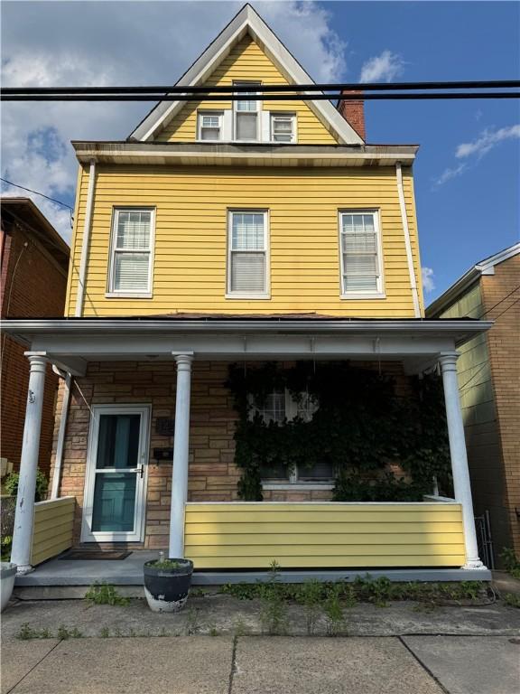 1428 Evergreen Ave, Shaler, PA 15209 - view of front facade with covered porch and a chimney