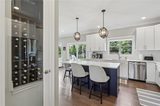 1010 Colony, Collier Twp, PA 15205 - kitchen with stainless steel dishwasher, decorative backsplash, white cabinetry, a kitchen bar, and light countertops