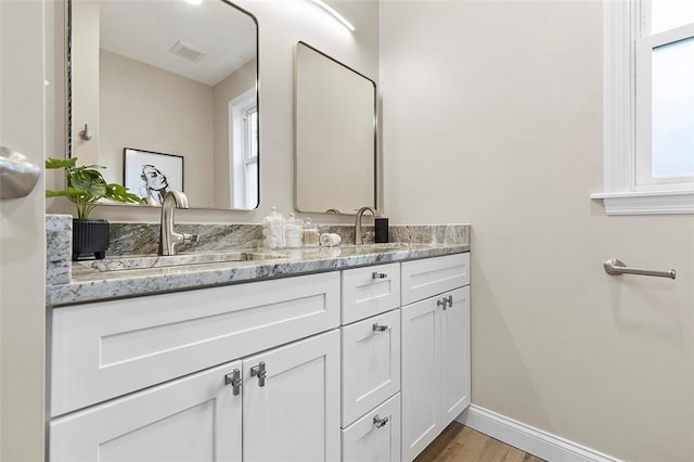 241 S Starr Ave, Avalon, PA 15202 - bathroom featuring double vanity and wood finished floors