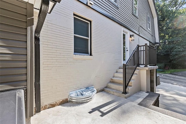 241 S Starr Ave, Avalon, PA 15202 - view of exterior entry featuring brick siding and a patio