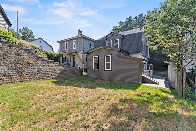 241 S Starr Ave, Avalon, PA 15202 - back of house with roof with shingles, a chimney, and a lawn