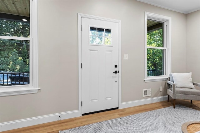 241 S Starr Ave, Avalon, PA 15202 - foyer entrance with wood finished floors, plenty of natural light, and crown molding