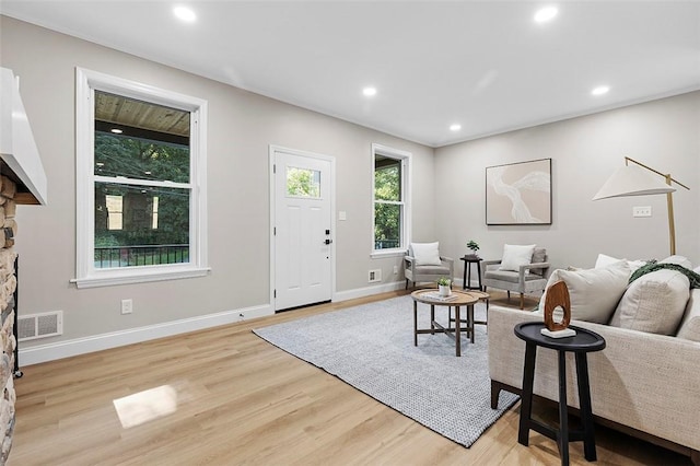 241 S Starr Ave, Avalon, PA 15202 - living area featuring light wood finished floors, recessed lighting, and a fireplace