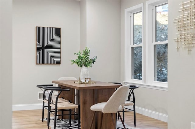241 S Starr Ave, Avalon, PA 15202 - dining room featuring baseboards and light wood-type flooring