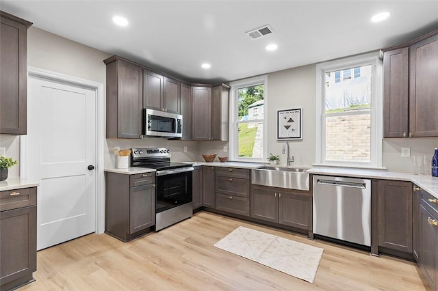 241 S Starr Ave, Avalon, PA 15202 - kitchen featuring stainless steel appliances, light wood-style floors, dark brown cabinetry, light countertops, and recessed lighting