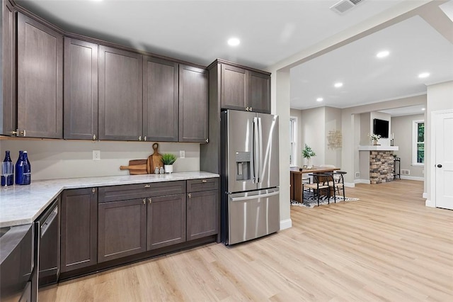241 S Starr Ave, Avalon, PA 15202 - kitchen featuring stainless steel appliances, dark brown cabinetry, light wood-style flooring, recessed lighting, and light stone counters