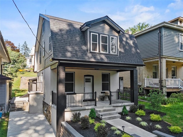 241 S Starr Ave, Avalon, PA 15202 - dutch colonial with a porch, a shingled roof, brick siding, and a gambrel roof