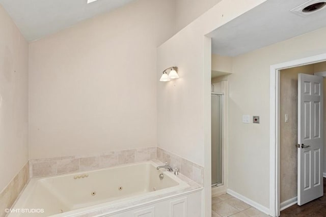 9810 Three Degree Rd, Mccandless, PA 15101 - full bath featuring a jetted tub, a shower stall, and tile patterned flooring