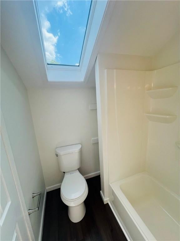 543 Burton Dr, Penn Hills, PA 15235 - full bathroom with a skylight, wood finished floors, and shower / bathtub combination