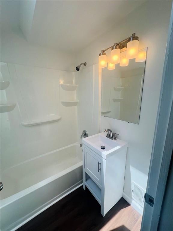 543 Burton Dr, Penn Hills, PA 15235 - bathroom with vanity, shower / bath combination, and wood finished floors