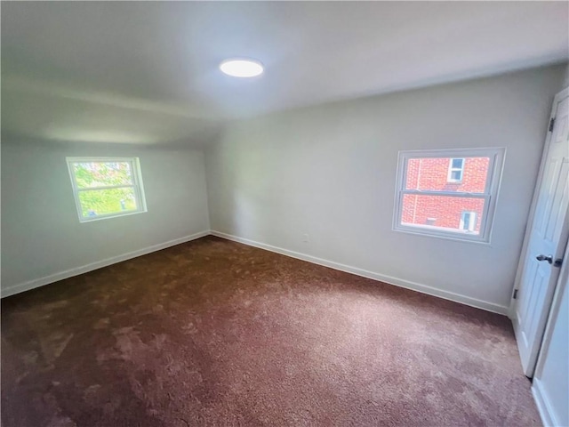 543 Burton Dr, Penn Hills, PA 15235 - spare room featuring dark carpet and vaulted ceiling