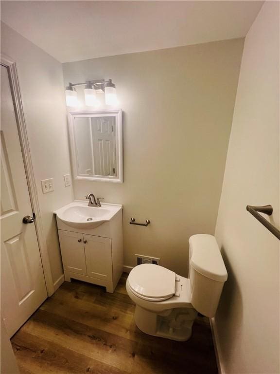 543 Burton Dr, Penn Hills, PA 15235 - bathroom featuring wood finished floors and vanity