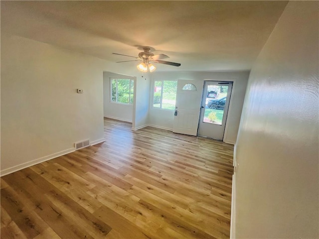 543 Burton Dr, Penn Hills, PA 15235 - unfurnished living room with light wood-type flooring and ceiling fan