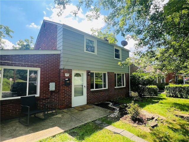 543 Burton Dr, Penn Hills, PA 15235 - back of house with brick siding and a yard
