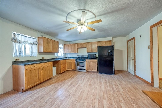 75 Wilson St, Etna, PA 15223 - kitchen with black appliances, light wood-type flooring, a ceiling fan, dark countertops, and a textured ceiling