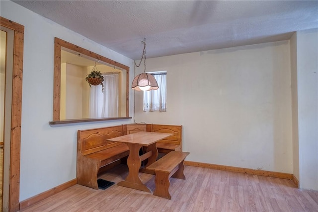 75 Wilson St, Etna, PA 15223 - dining area featuring light wood-style flooring and a textured ceiling