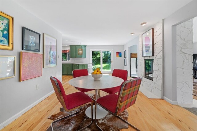 32 Canter Dr, Sewickley Hills Boro, PA 15143 - dining space featuring light wood finished floors and a stone fireplace