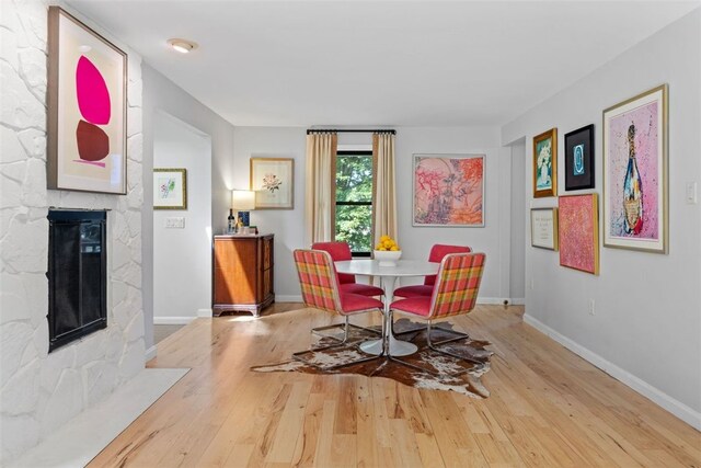 32 Canter Dr, Sewickley Hills Boro, PA 15143 - dining room with wood finished floors and a stone fireplace