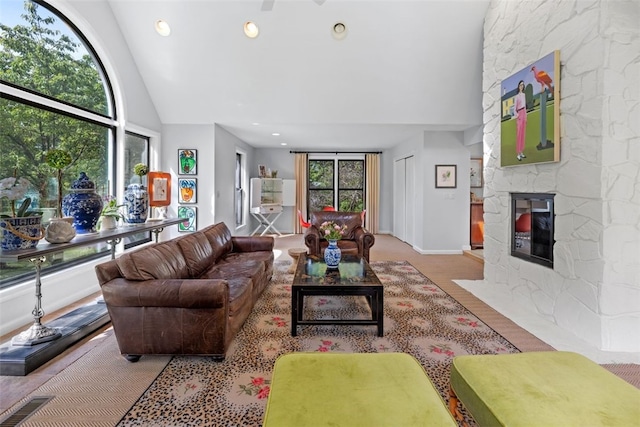 32 Canter Dr, Sewickley Hills Boro, PA 15143 - living room with healthy amount of natural light, high vaulted ceiling, a fireplace, wood finished floors, and recessed lighting