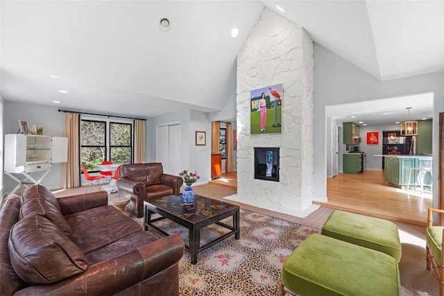 32 Canter Dr, Sewickley Hills Boro, PA 15143 - living room featuring wood finished floors, high vaulted ceiling, recessed lighting, and a stone fireplace