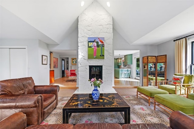 32 Canter Dr, Sewickley Hills Boro, PA 15143 - living area with vaulted ceiling, wood finished floors, and a stone fireplace