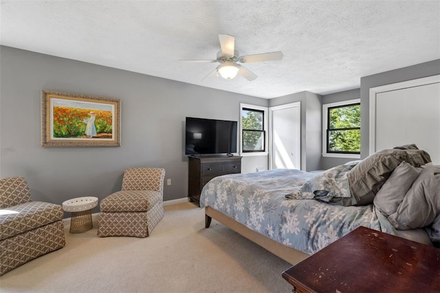 32 Canter Dr, Sewickley Hills Boro, PA 15143 - bedroom with carpet flooring, two closets, a ceiling fan, and a textured ceiling