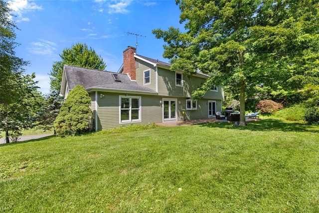 32 Canter Dr, Sewickley Hills Boro, PA 15143 - rear view of property with a lawn and a chimney