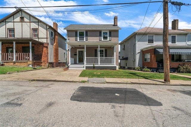 1106 Wade St, Aliquippa, PA 15001 - view of front of house with a porch, a chimney, and a front yard