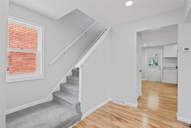 1106 Wade St, Aliquippa, PA 15001 - staircase with wood finished floors and recessed lighting