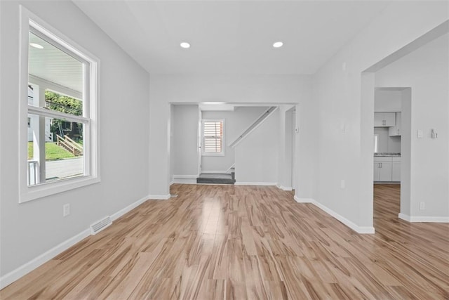 1106 Wade St, Aliquippa, PA 15001 - empty room featuring stairway, light wood-style floors, and recessed lighting