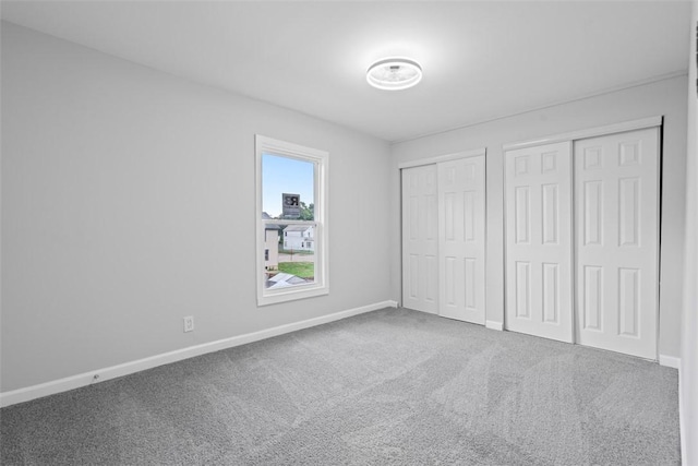 1106 Wade St, Aliquippa, PA 15001 - unfurnished bedroom featuring two closets and carpet floors