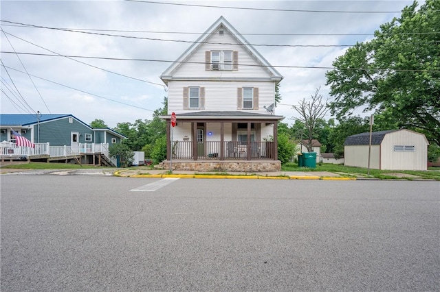 701 E 1st Ave, Derry Boro, PA 15627 - view of front of home featuring a storage shed and covered porch