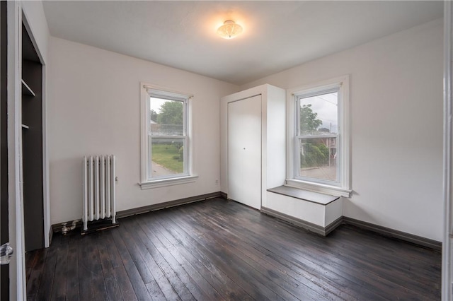 701 E 1st Ave, Derry Boro, PA 15627 - unfurnished bedroom featuring radiator heating unit and dark wood-type flooring