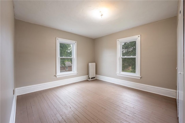 701 E 1st Ave, Derry Boro, PA 15627 - empty room with radiator and hardwood / wood-style flooring