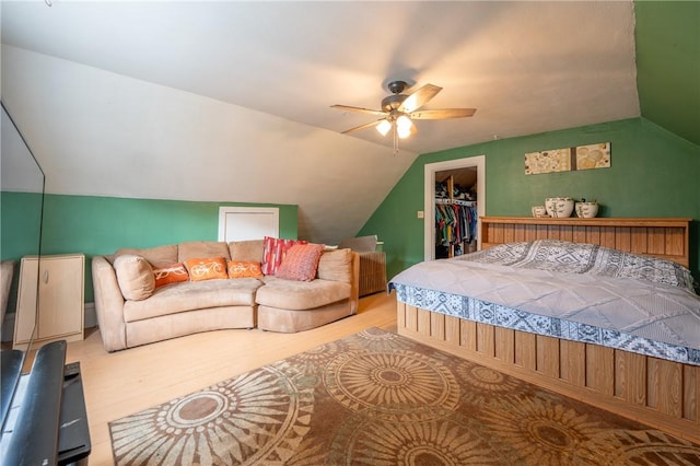 701 E 1st Ave, Derry Boro, PA 15627 - bedroom with wood finished floors, vaulted ceiling, a closet, a walk in closet, and a ceiling fan