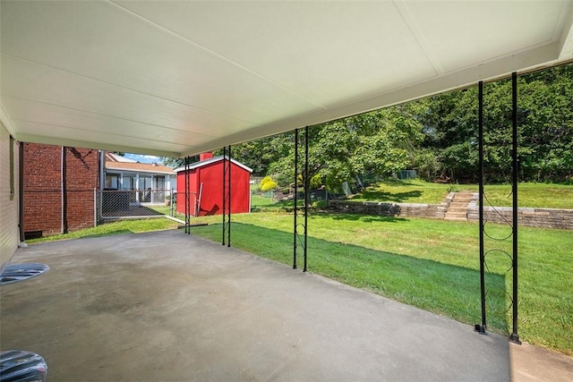 332 Garlow Dr, Penn Hills, PA 15235 - view of patio featuring a carport and a storage unit