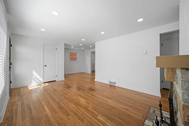 332 Garlow Dr, Penn Hills, PA 15235 - unfurnished living room featuring a fireplace, recessed lighting, and wood finished floors