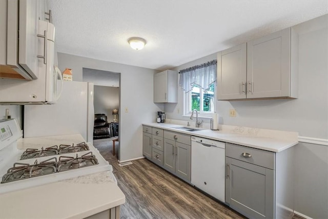 4044 Tuxey Ave, Brentwood, PA 15227 - kitchen with gray cabinets, white appliances, dark wood finished floors, light countertops, and a textured ceiling