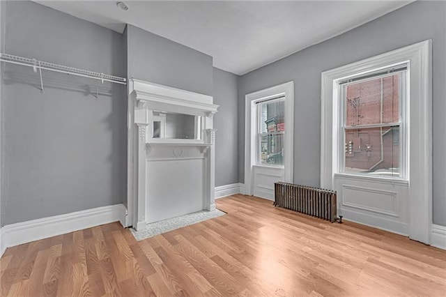 375 Main St, Lawrenceville, PA 15201 - unfurnished bedroom featuring radiator heating unit and light wood-type flooring