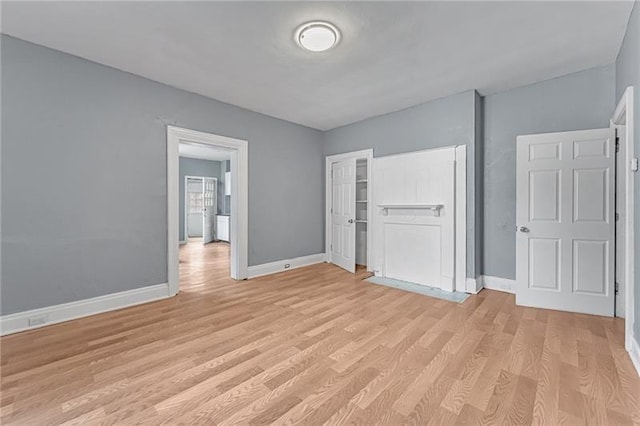 375 Main St, Lawrenceville, PA 15201 - unfurnished bedroom featuring light wood-type flooring and a closet