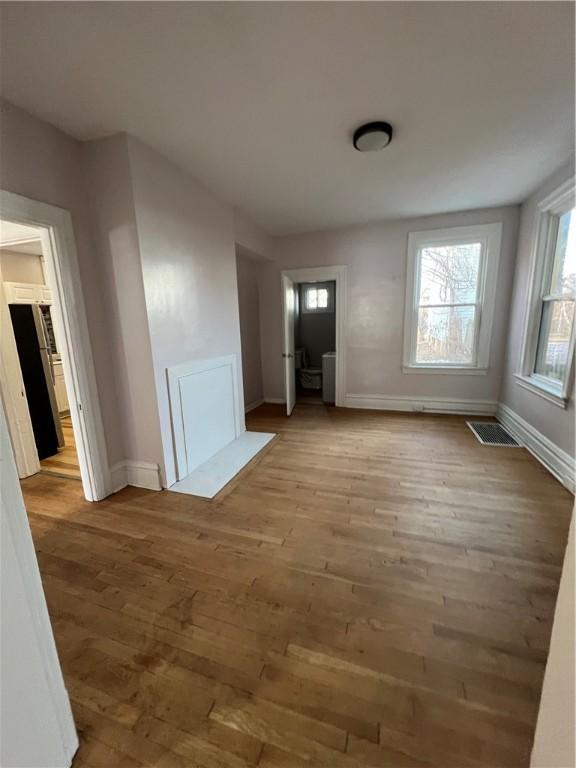 1238 Superior Ave, Marshall Shadeland, PA 15212 - unfurnished living room featuring baseboards and wood finished floors