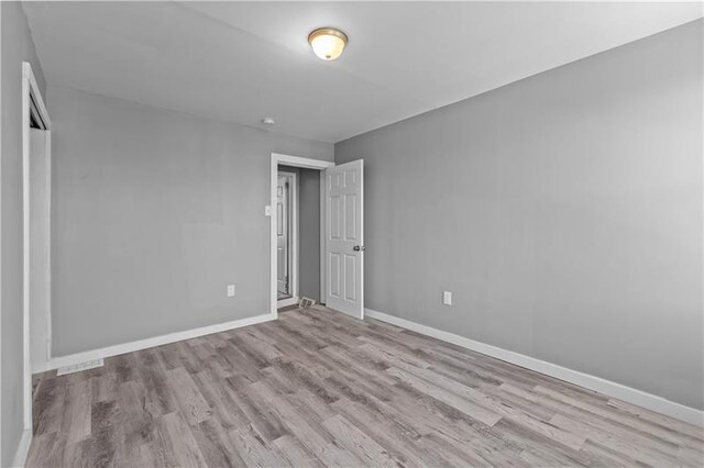 363 44th St, Lawrenceville, PA 15201 - unfurnished bedroom featuring wood finished floors and a closet